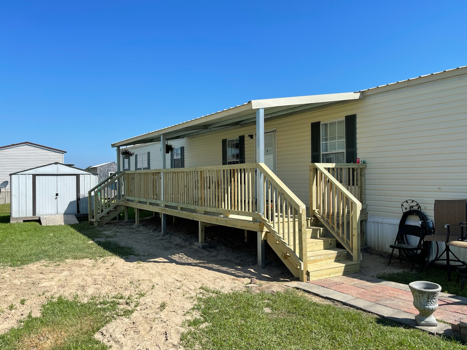 Completed raised deck and patio cover on a trailer home