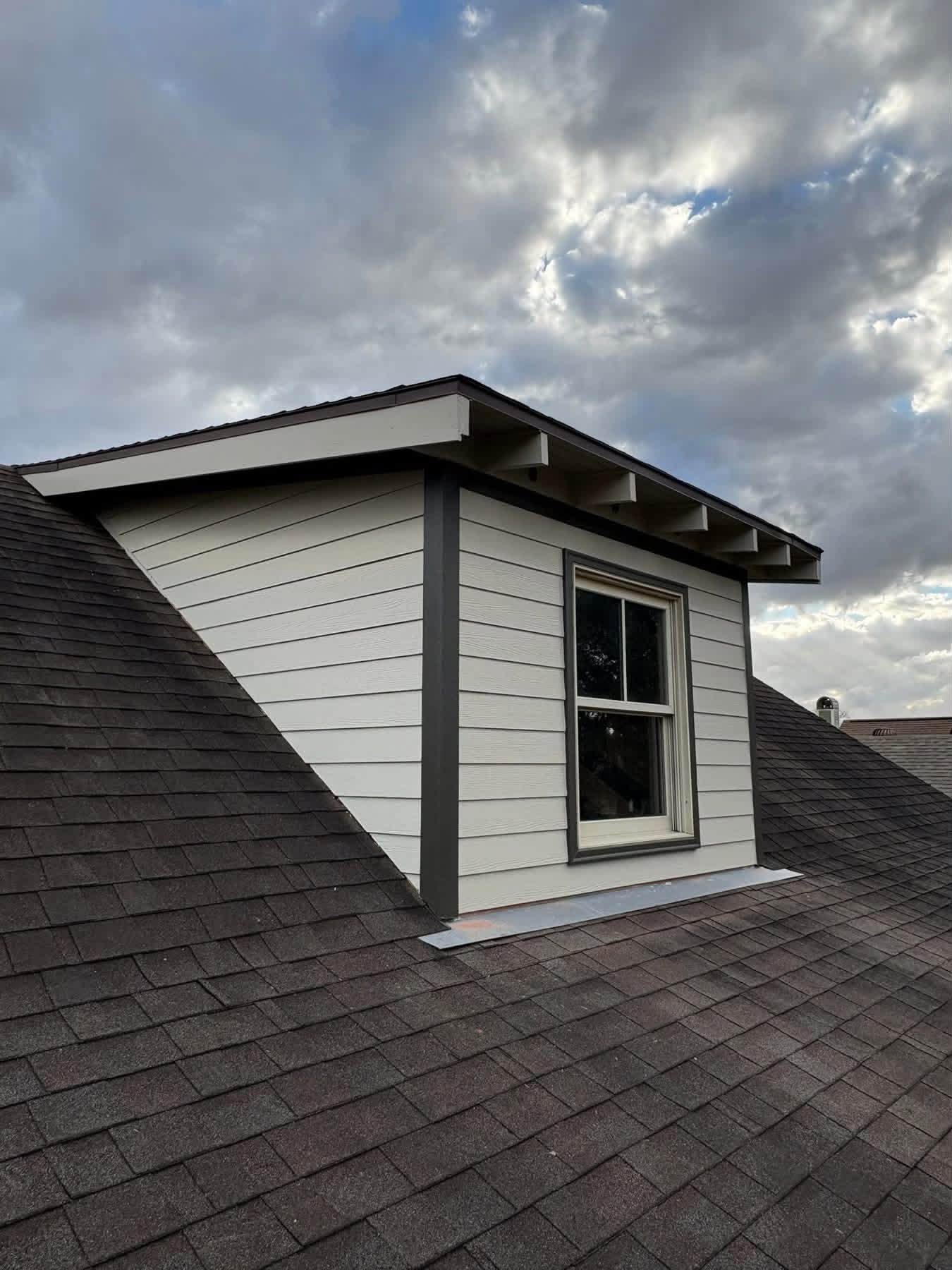 Finished roof dormer after siding, trim, and fascia restoration